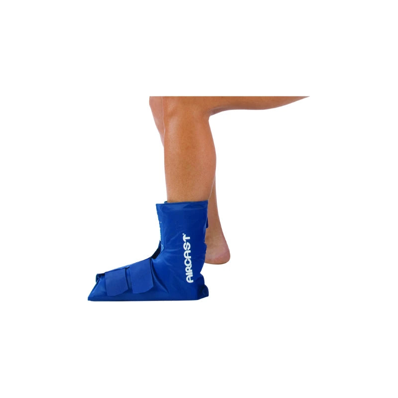 Person wearing blue ankle foot orthopedic boot for injury recovery