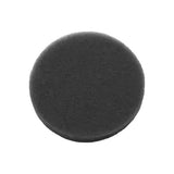 Black circular foam filter for respiratory medical equipment on white background