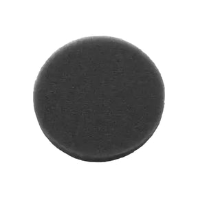 Black circular foam filter for respiratory medical equipment on white background