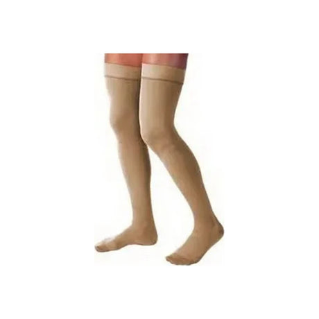 Beige medical compression stockings thigh-high on model legs against white background.