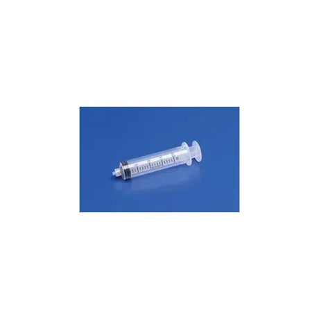 Disposable medical syringe with measurement markings on blue background