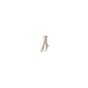 Person wearing beige knee-high compression stockings on a white background