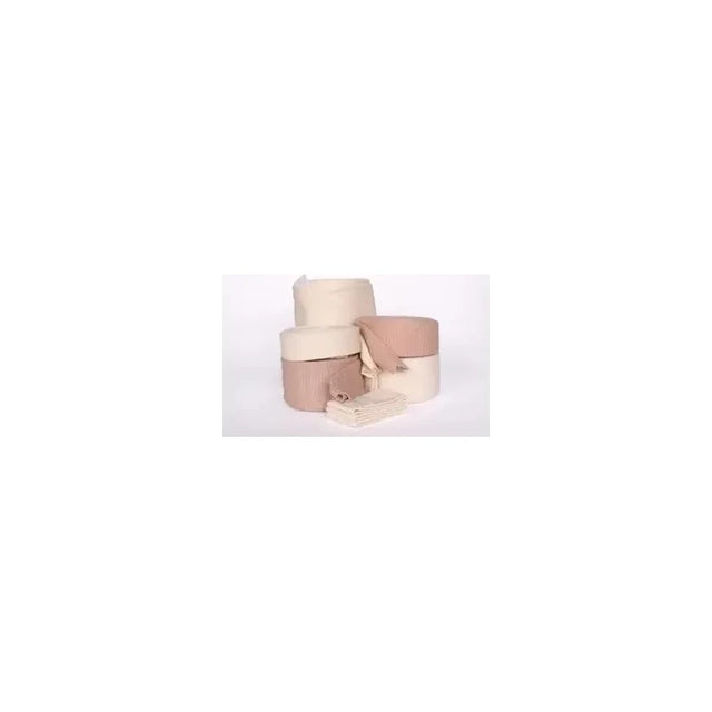 Assorted beige and brown medical bandages and gauze rolls on a white background