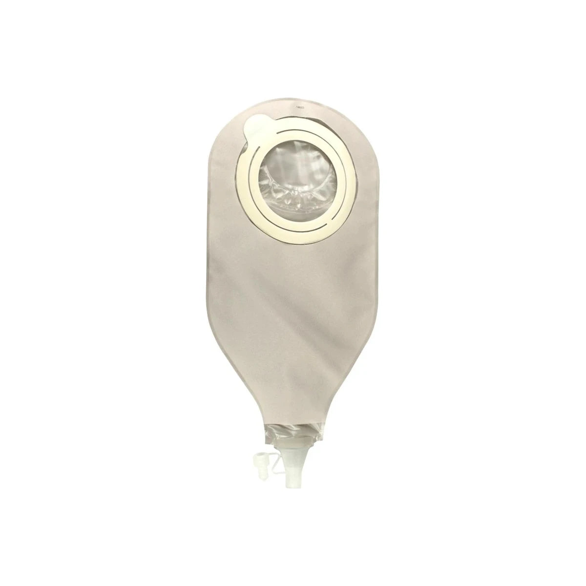 Closed beige medical ostomy drainage bag with circular adhesive and tap valve on white background