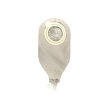 Closed beige medical ostomy drainage bag with circular adhesive and tap valve on white background