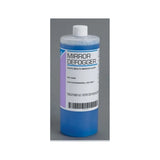 Dental mirror defogger solution bottle for professional use on gray background