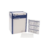 Sterile medical gauze pads in packaging and individual pouches on white background