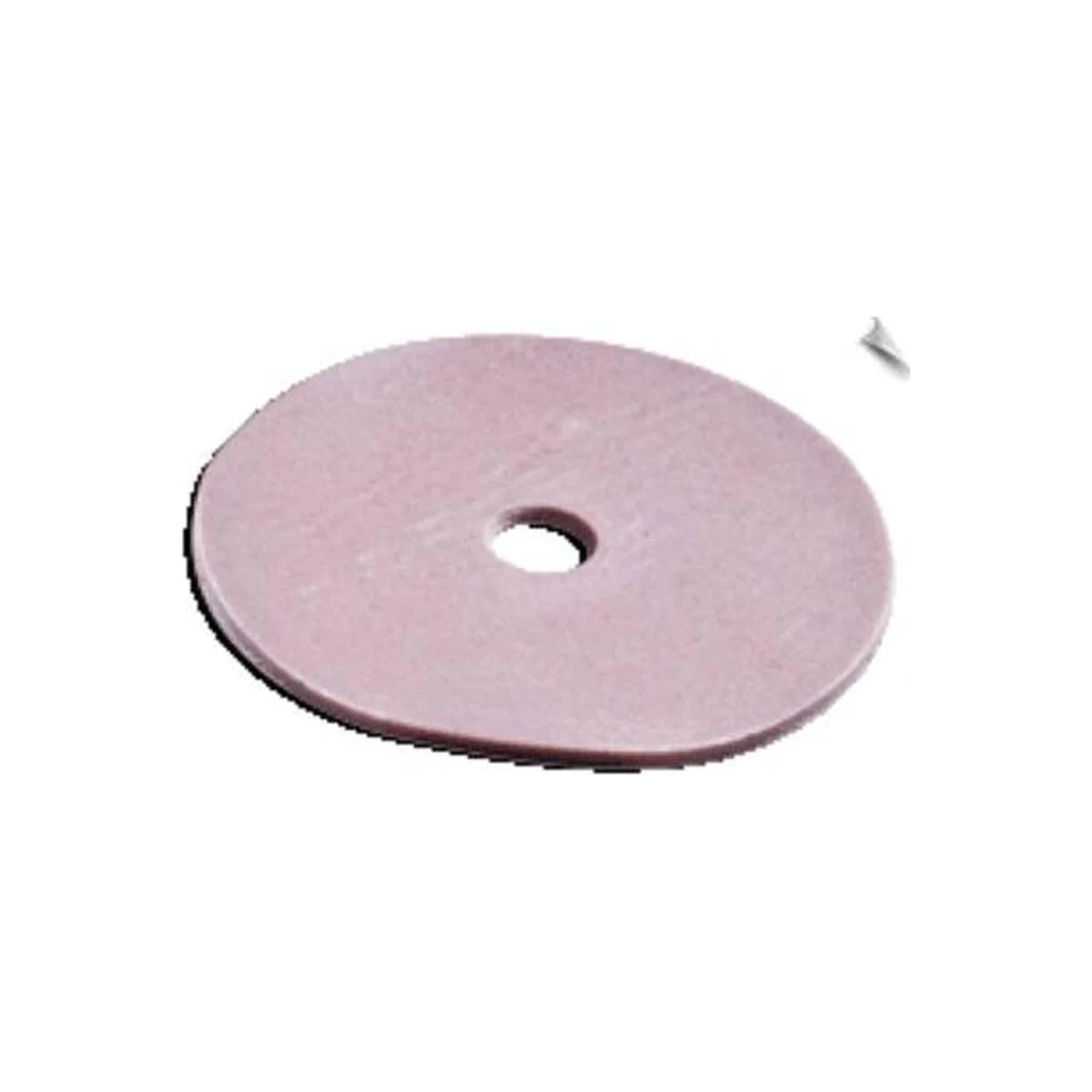 Round pink ostomy barrier ring with center hole on white background