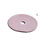 Round pink ostomy barrier ring with center hole on white background