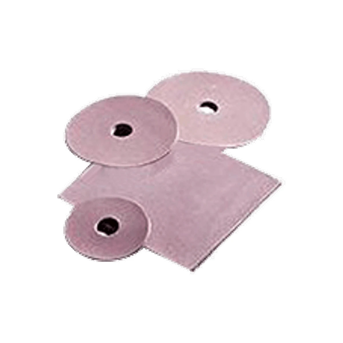 Assorted pink ostomy barrier rings and sheets on white background, medical supplies