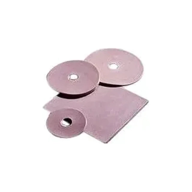 Adhesive ostomy barrier discs and square sheet for stoma care on white background