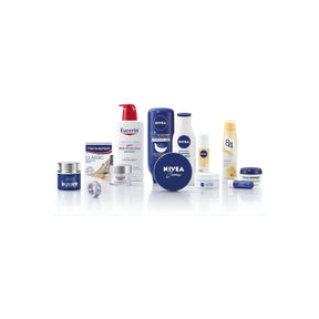 Assorted skincare and body care products including creams, lotions, and lip balm on white background.