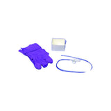 Medical supply kit with purple gloves, gauze, and a medical tube on white background