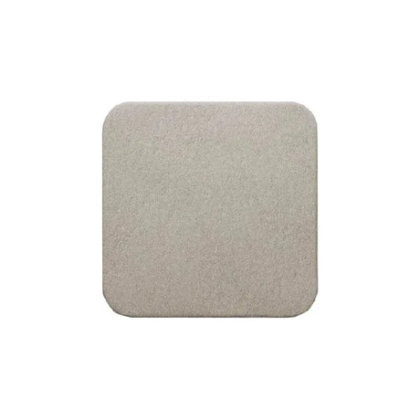 Square beige medical foam dressing with rounded edges on white background