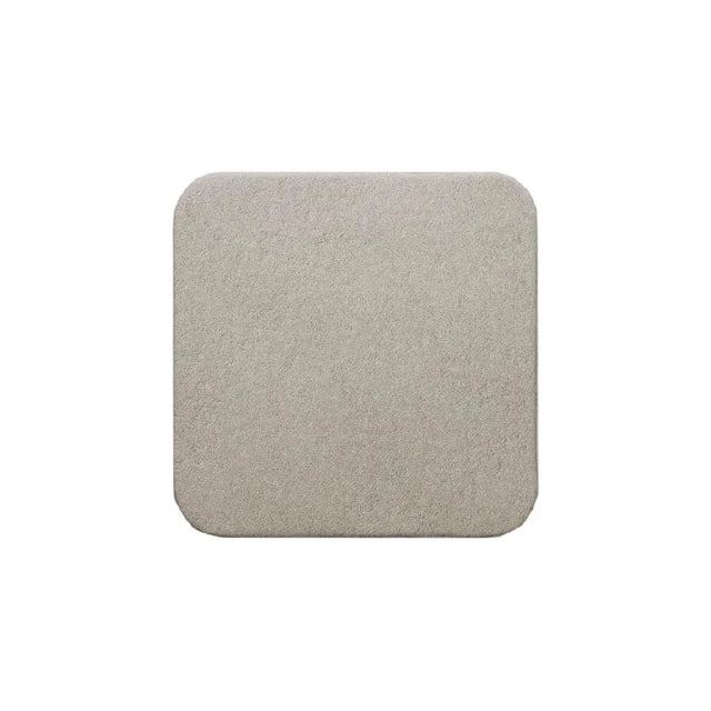 Square beige medical foam dressing with rounded edges on white background