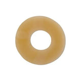 Beige round ostomy barrier ring for skin protection, isolated on white background