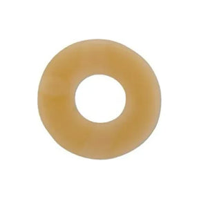 Beige round ostomy barrier ring for skin protection, isolated on white background