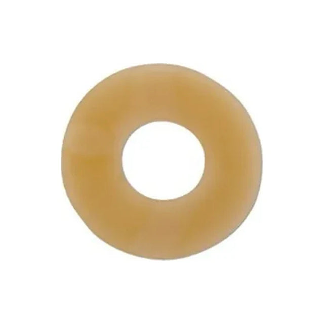 Beige round ostomy barrier ring for skin protection, isolated on white background