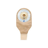 One-piece beige ostomy bag with adhesive barrier for stoma care, medical supply product.