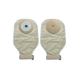 Two beige ostomy pouches with adhesive flanges and drainable openings on a white background.