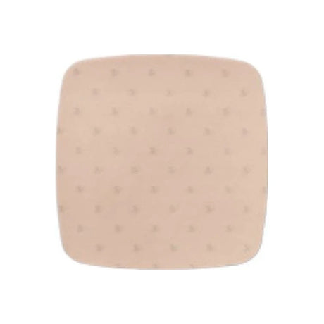 Beige hydrocolloid wound dressing pad, square with rounded edges, isolated on white background
