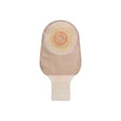 Drainable beige ostomy pouch with adhesive barrier for stoma care on white background