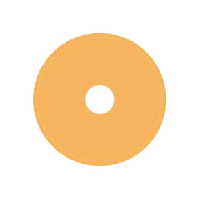 Beige round ostomy barrier wafer with central hole, medical supply on white background