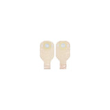 Pair of beige ostomy pouches with adhesive barriers for medical use on white background