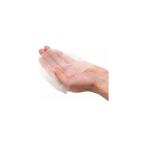 Hand holding a sterile medical gauze dressing for wound care and protection
