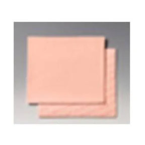 Peach-colored medical foam dressing pads, square shape, on plain background