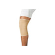 Elastic beige knee support sleeve worn on leg for joint support and compression.