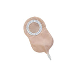 Beige one-piece drainable ostomy bag with adhesive barrier on white background