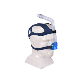 Nasal CPAP mask with blue headgear and flexible tubing on mannequin head for sleep apnea