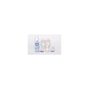 Saline wound flush bottles and medical supplies for wound care on a white background.