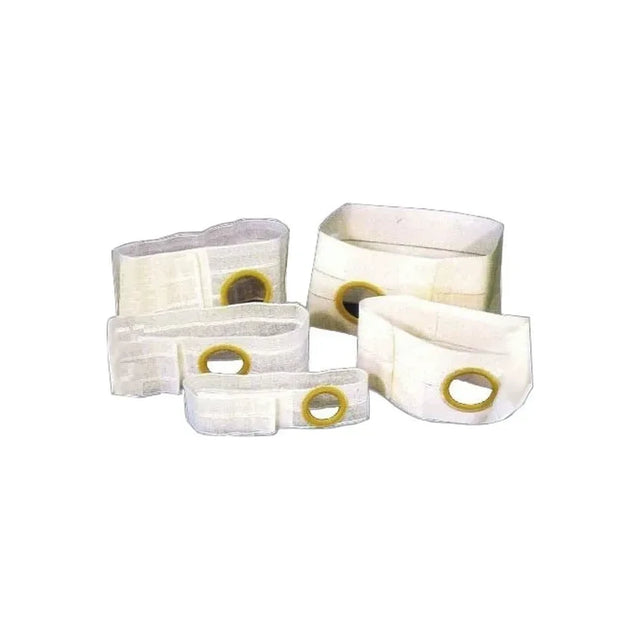 Group of white ostomy belts with round openings for medical support