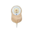 Beige one-piece drainable ostomy bag with adhesive barrier on white background