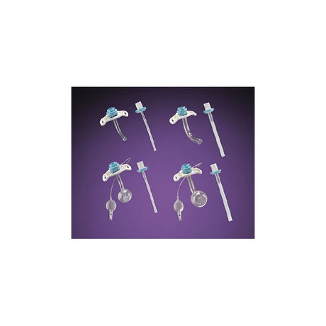 Assorted tracheostomy tubes and accessories on a purple background, medical supply image