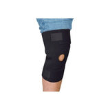 Black knee brace with patella opening worn on leg, orthopedic support for knee pain