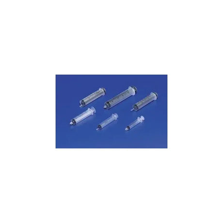 Assorted medical syringes on blue background, essential for home healthcare needs