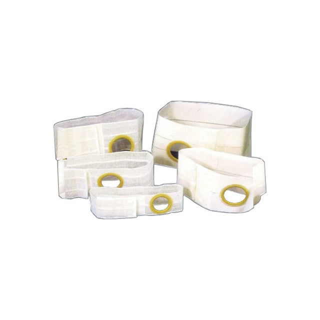 Assorted medical ostomy belts with circular openings on a white background
