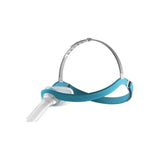 CPAP nasal mask with blue headgear and flexible hose for sleep apnea therapy