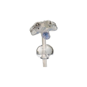Close-up of a medical gastrostomy feeding tube with balloon and labeled ports