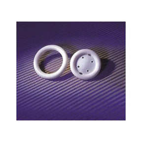 Two white medical pessary rings on a purple textured background