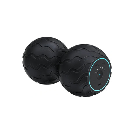 Black vibrating double massage ball for muscle relief, textured surface, isolated on white
