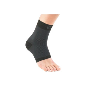 Black ankle compression support sleeve worn on left foot for joint pain relief