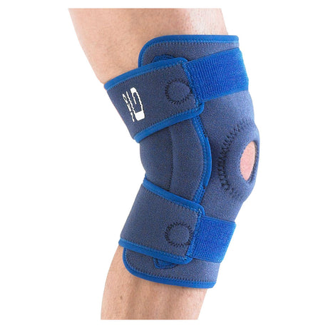 Adjustable blue knee brace with open patella for joint support on a person's knee