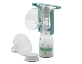 Manual breast pump with teal handle, clear flange, and a milk collection bottle