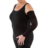 Woman wearing medical compression arm sleeve on left arm against white background