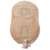 Beige urostomy drainage pouch with discreet spout, medical ostomy supply on white background