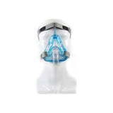 Full face CPAP mask with blue cushion and grey headgear on a white mannequin